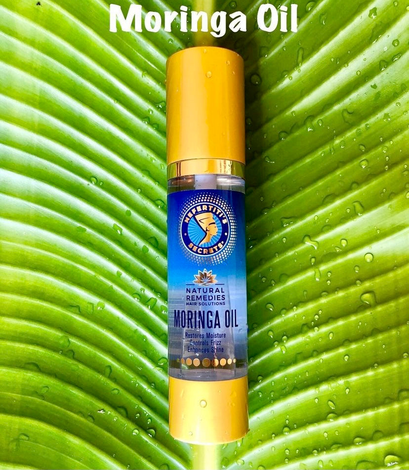 Nefertitit&#39;s Secret Moringa Oil bottle on Leaf